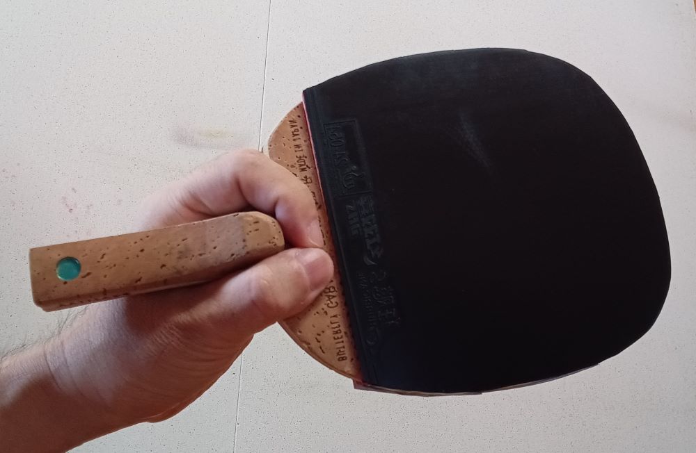 Penhold grip viewed from the forehand side of a table tennis racket